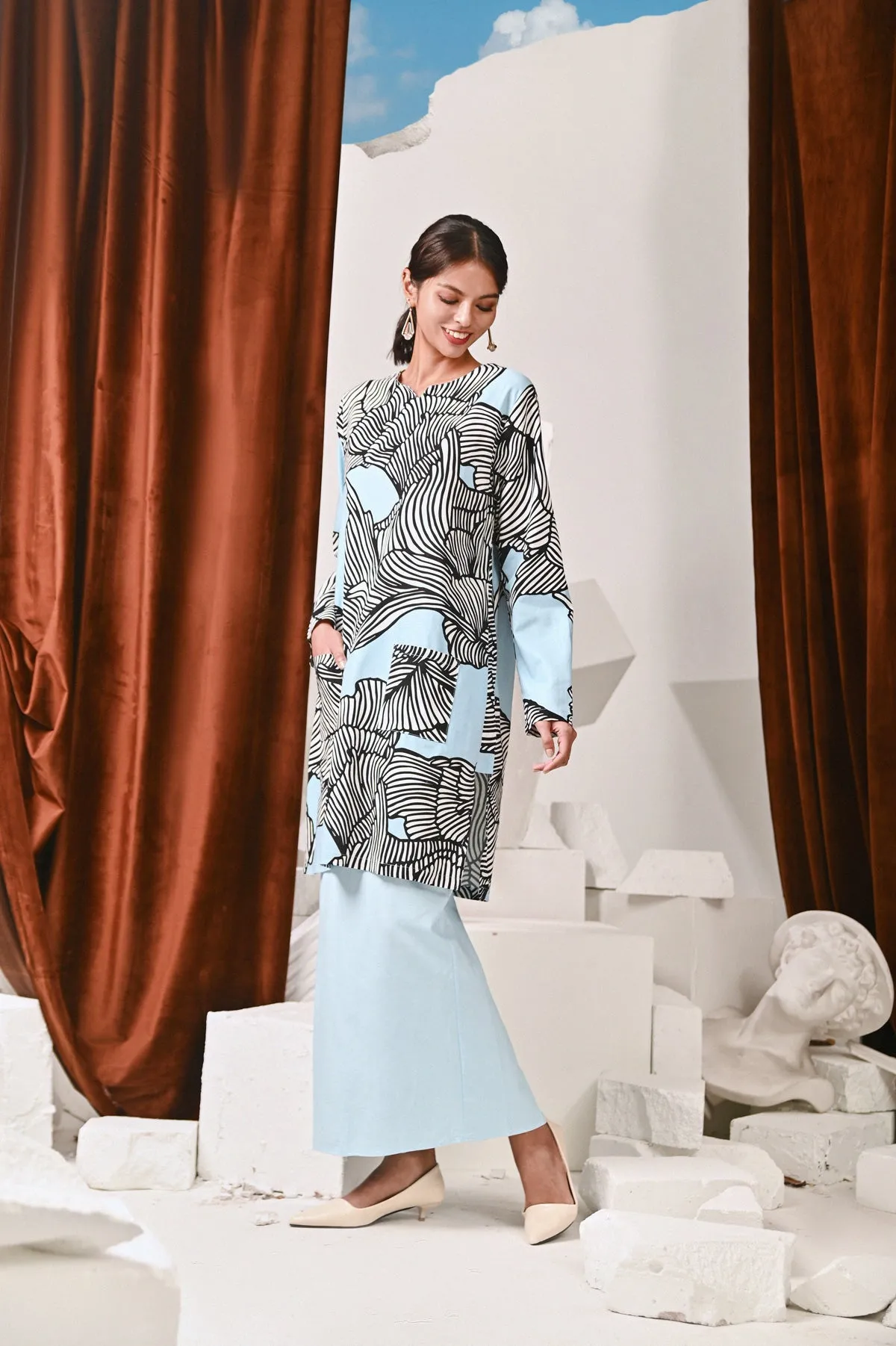 The Kita Menang Women Back Pleats Skirt - Light Blue