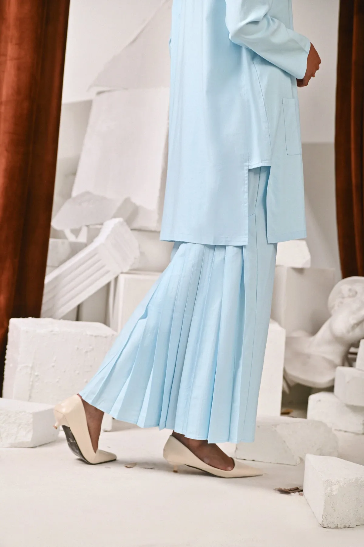 The Kita Menang Women Back Pleats Skirt - Light Blue