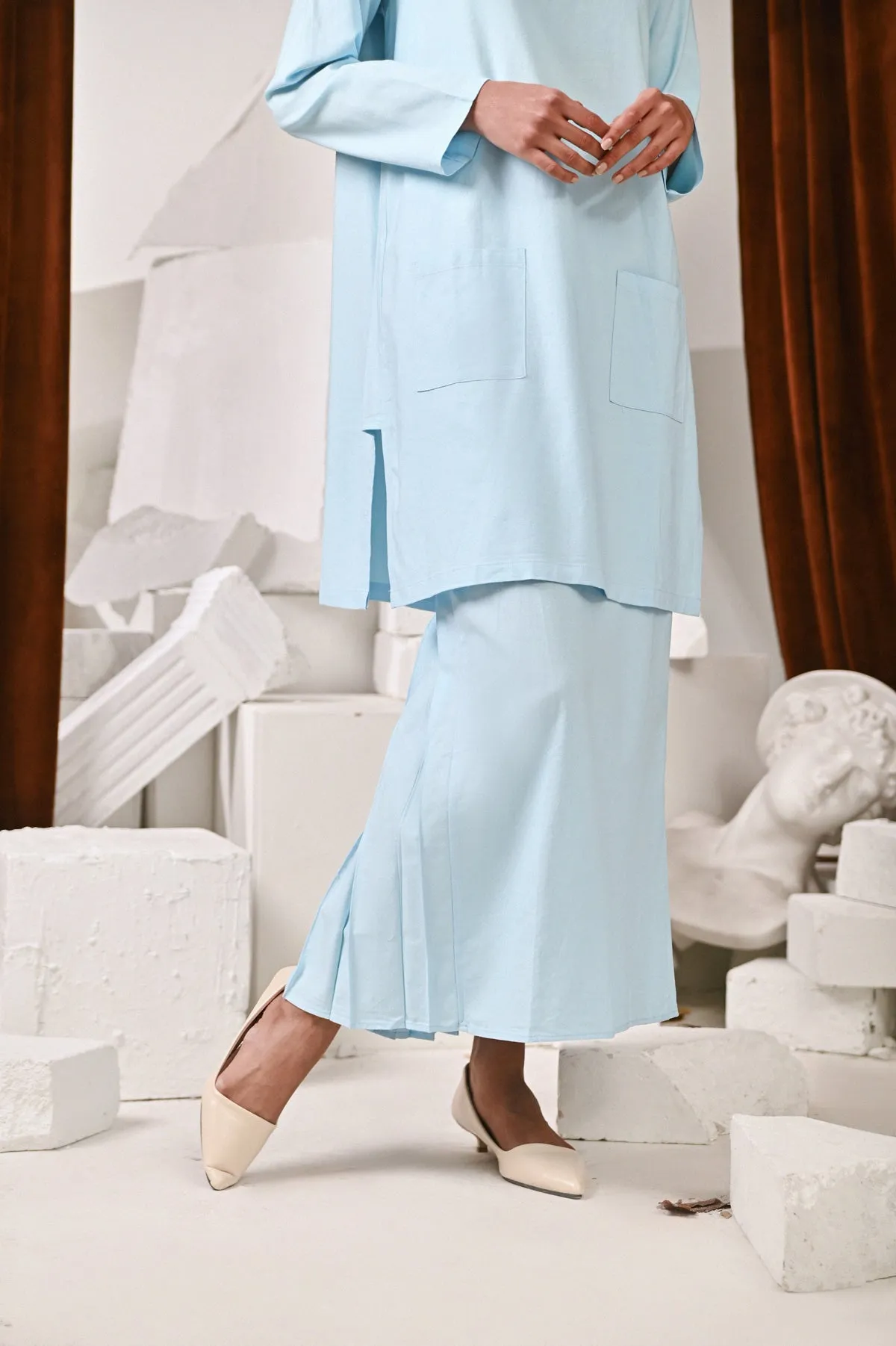 The Kita Menang Women Back Pleats Skirt - Light Blue
