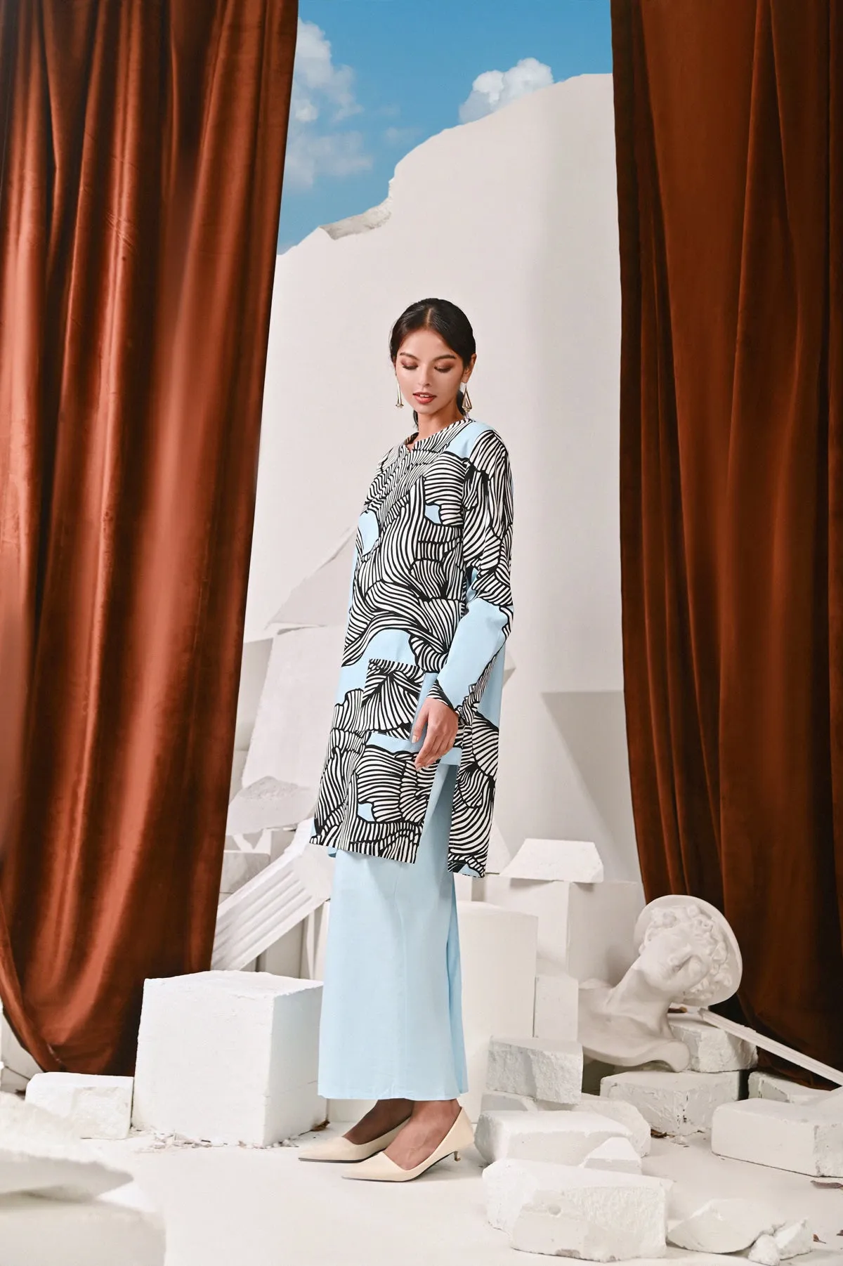 The Kita Menang Women Back Pleats Skirt - Light Blue
